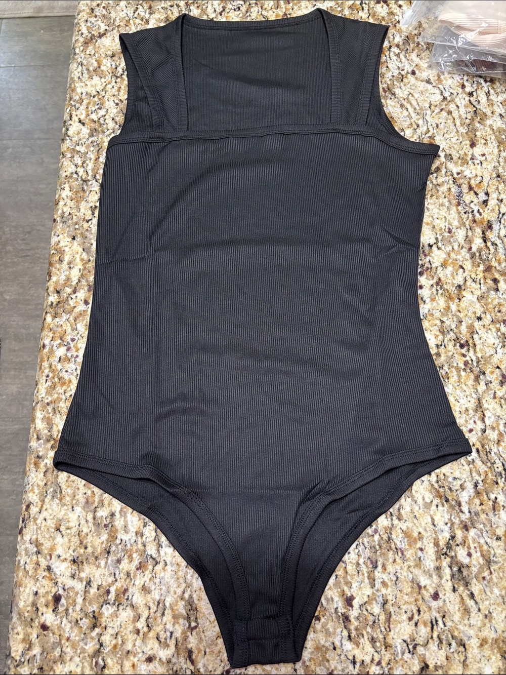 Women’s Black Ribbed One-Piece Bodysuit